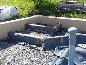 Réalisation d'un parking de garage et d'une allée en béton drainant.