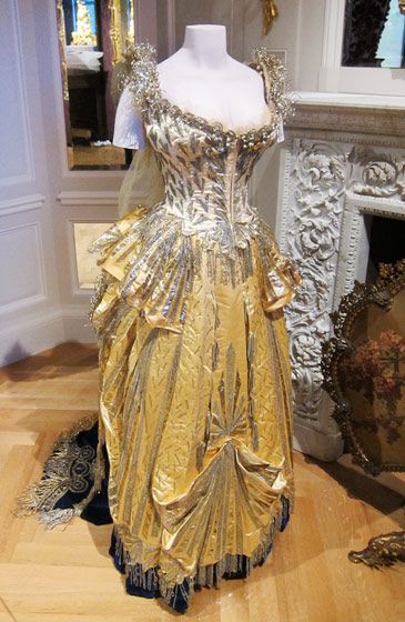 Details of dress "Electric Light" from Charles Frederick Worth 1883. (Pictures Museum of the City of New York.  http://www.sickpupsnot.org/mcityofny/redgold.html )