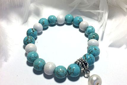 Bracelet turquoise et sa perle blanche