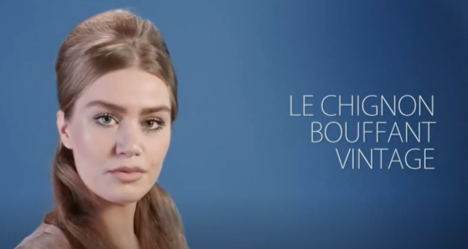 une jeune femme ayant un chignon bouffant d'inspiration vintage