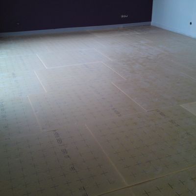 Pose de l'isolant au sol