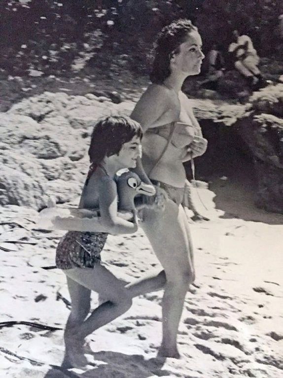 Elizabeth Taylor, Richard Burton and Liza Todd have fun on the beach in Mexico, October 1963. Another day, Liza's brothers join them on the beach.