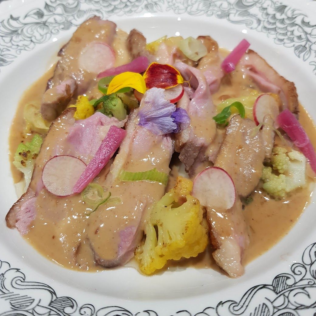 Magret de canard sauce cacahuète Lagano restaurant Paris 7