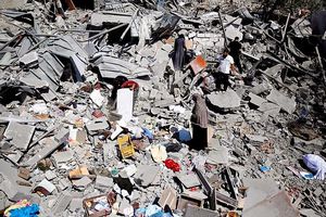 Families search the remains of their homes in Beit Hanoun, Gaza Strip