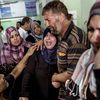 Palestinian relatives cry at the Kamal Odwan hospital in Beit Lahiya following an Israeli army shelling