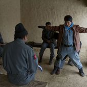 Afghan Uniformed Police (AUP) officers practice searching each another during a class in the Kajran district, Daykundi province, Afghanistan, Feb 120205-N-JC271-036.jpg