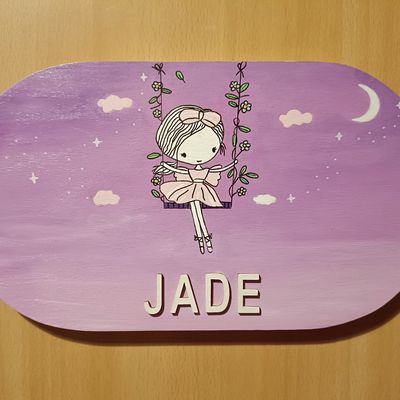 Une plaque de porte de chambre en bois pour prénom petite fille 