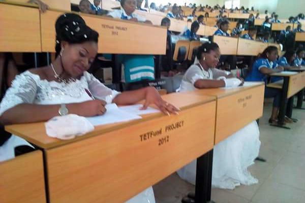 Two Benue State University Students Write Final Year Exams In Their Wedding Gowns (Photos)