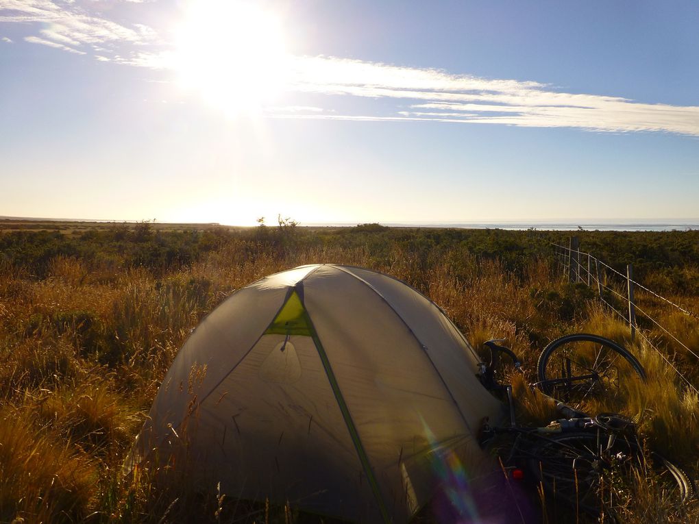 After a last night of camping and a last day of biking on the unpaved Chilean road, I arrived to the Argentinian border where once again I benefited from the Argentinian hospitality as I was able to cook and sleep in a waiting room at the customs. The next days were back on the paved road, with heavier and fast traffic until Ushuaia, nothing of an end of the road feel as I had been warned. I got mad after drivers in a way I hadn't been in a long time, as they would just honk at me, expecting I'd get off the road each time to let them pass (which of course I wouldn't do). I was also hosted in an Estancia (one of these gigantic properties with huge herds of cows or sheep), then in a bakery whose owner was welcoming every biker coming through Tolhuin. I biked the last 100 km of the trip under the rain and in the fog, before arriving, finally, in Ushuaia. During the entire trip I hadn't shed a single tear, even during the toughest moments, and 10 km before the end a jeep passed by me and all the passengers openes their windows and cheered at me, shouting "yaay, contratulations, you made it!", and suddenly my emotional valve reopenned and I cried all my soul, of happiness, of sadness, of everything, realizing what I just had accomplished, and how long I had imagined that moment.