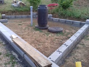 Réalisation d'un parking de garage et d'une allée en béton drainant.