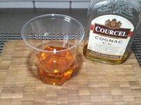 1 - Peler, dégermer l'ail et le hacher en petits morceaux. Tailler également le gingembre frais en fine brunoise. Ciseler le persil plat et la ciboulette. Préparer le Cognac.