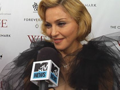 Hosted by the Weinstein Company and The Cinema Society, at the Ziegfield Theater in New York on January 23, 2012. Madonna wears a Marchesa dress. Marchesa designer Georgina Chapman is married to Harvey Weinstein.