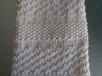 le crème : point de damier 2 m. et point de riz, le turquoise point de damier 4 m. et point de riz, le vert et crème jersey et point de mousse sur les bordures