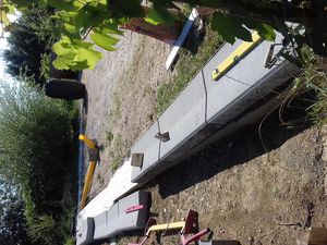 Réalisation d'un parking de garage et d'une allée en béton drainant.