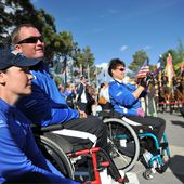 Former U.S. Air Force Staff Sgt. Stacy Pearsall, foreground, former Staff Sgt. Richard Pollock, middle ground, and retired Staff Sgt. Jeanne Goldy-Sanitate attend the opening ceremony of the inaugural Warrior 100510-F-QE915-181.jpg