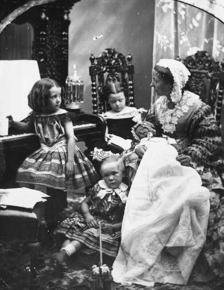 January 1860: A mother and children in the parlor: 27 Awesome Vintage Photos of Moms | Mental Floss