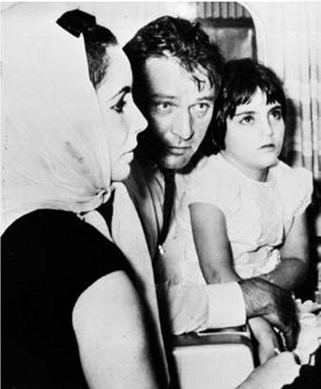 September 22 1963, brief stop in Toronto before flying to Mexico. Elizabeth Taylor, Richard Burton, and Liza Todd on his lap - September 23 1963, Mexico airport: Elizabeth Taylor keeps her arm tightly around Richard Burton as Liza Tood clings to his neck on arrival at the airport. The stars were besiged by a pressing throng. Arrival at Mexico airport. From one plane to another: Liza Todd with her mother Elizabeth Taylor. 