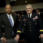 Department of Defense General Counsel Jeh C. Johnson, left, and U.S. Army Gen. Carter Ham appear before the Senate Armed Services Committee to testify about the "Don't Ask, Don't Tell" 101202-N-TT977-022.jpg