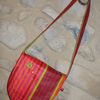 Sac bandoulière rayé rose, rouge, orange, vert, intérieur vert