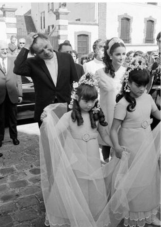 1968 June 22 - France, Montpertuis, in Seine et Marne: wedding of Elizabeth's hairdresser Claude Ettori with phototographer Gianni Bozzachi. Liza and Maria are maids of honor. Elizabeth Taylor and Richard Burton walk proudly behind them - New York: Elizabeth Taylor, Richard Burton, Liza Todd and Kate Burton leaving the cruise boat Queen Elizabeth II.