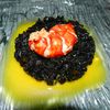 Médaillon de homard au riz noir et sa sauce à l'orange