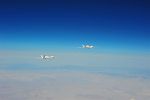 2 Global Hawk Unmanned Aircraft Fly in Close Formation