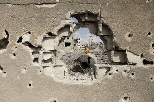 Gaza Under Attack : A Palestinian inspects destroyed houses
