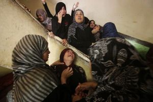 Relatives of Palestinian  Abduallah El-Buhasi, who was killed in an Israeli air strike