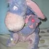 Eeyore pastel avec une fleur et un papillon