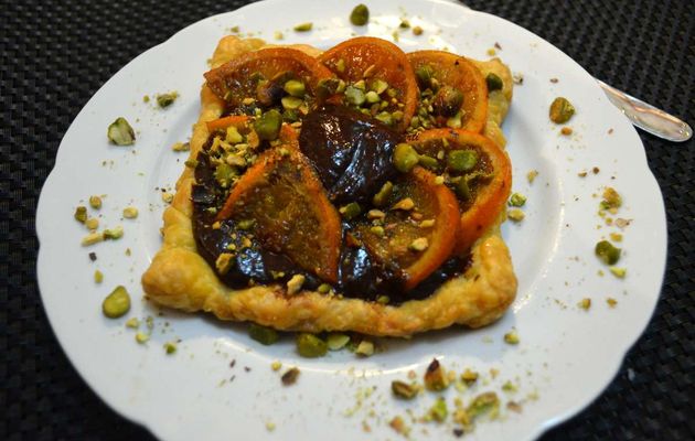 Tartelette fine aux mandarines confites, ganache chocolat et pistaches